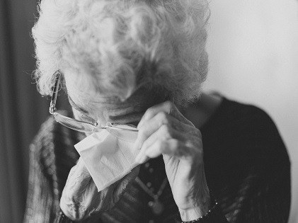 old woman senior crying retirement